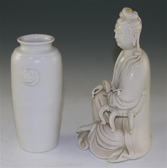 A Chinese Dehua blanc-de-chine seated figure of Guanyin and a similar vase, 17th/18th century,